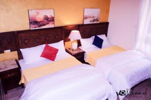 Ένα ή περισσότερα κρεβάτια σε δωμάτιο στο The location Hotel