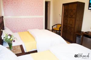 Ένα ή περισσότερα κρεβάτια σε δωμάτιο στο The location Hotel