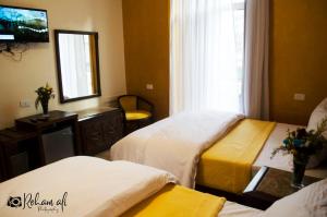 Ένα ή περισσότερα κρεβάτια σε δωμάτιο στο The location Hotel