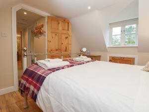 Cama o camas de una habitación en The Cottage At Barrow Mead