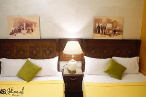 Ένα ή περισσότερα κρεβάτια σε δωμάτιο στο The location Hotel