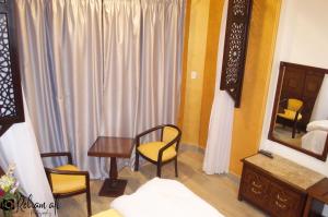 Ένα ή περισσότερα κρεβάτια σε δωμάτιο στο The location Hotel