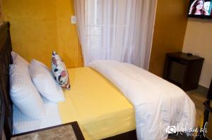 Ένα ή περισσότερα κρεβάτια σε δωμάτιο στο The location Hotel