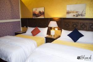 Ένα ή περισσότερα κρεβάτια σε δωμάτιο στο The location Hotel