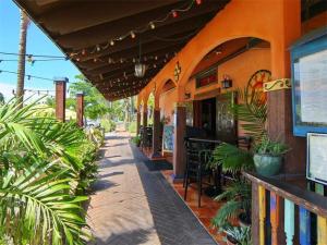 a building with an outdoor patio with plants on the sidewalk at Newly Fully Updated and Modern, Short Walk to BEACH in Siesta Key