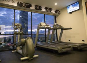 a gym with two tread machines in front of a window at Gumont Guadalajara López Mateos - Minerva in Guadalajara