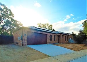 a brick house with a garage at My Place in Albury in Albury