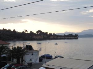a view of a body of water with boats in it at Parthenon Rooms in Koroni