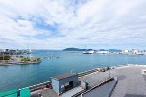 a view of a large body of water with a dock at Hotel Vega Takamatsu (Adult Only) in Takamatsu