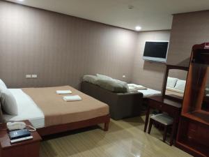 Postel nebo postele na pokoji v ubytování AB Star Suites