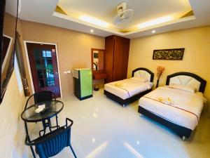 Postel nebo postele na pokoji v ubytování Benwadee Resort Pattaya