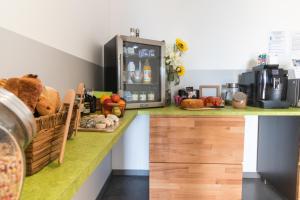 a kitchen with a counter with a microwave at H85 in Chatte