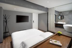 Katil atau katil-katil dalam bilik di 有集城市客栈锦绣中华店Unijoy Cityinn Splendid China Shenzhen
