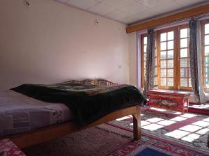 Postel nebo postele na pokoji v ubytování Julay Guest House