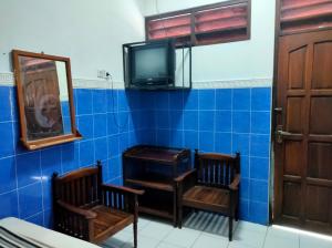 TV a/nebo společenská místnost v ubytování Hotel Arjuna Sari Bandungan