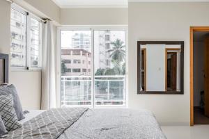 Rúm í herbergi á Luxurious Apartment In The Heart Of Santo Domingo