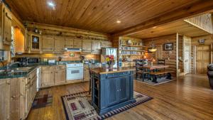 a large kitchen with wooden cabinets and a dining room at Plane View in Morganton