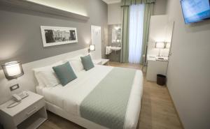Posteľ alebo postele v izbe v ubytovaní Nuovo Albergo Centro