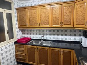 A kitchen or kitchenette at APARTAMENTO TURISTICO MILLAN