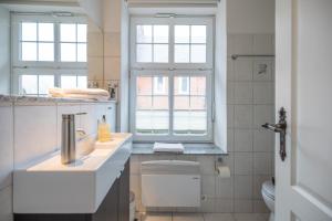 Koupelna v ubytování Alte Schule Horsbüll + 3 fotografie