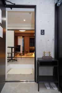 an open door into a room with a mirror at Asakusa New City Hotel in Tokyo