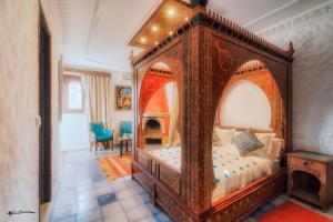 A bed or beds in a room at Casa Hassan