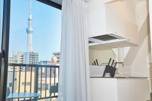 a kitchen with a view of the eiffel tower at Asakusa New City Hotel in Tokyo