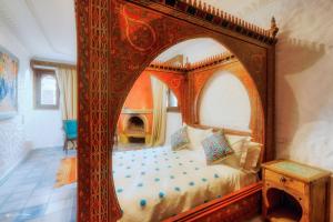 A bed or beds in a room at Casa Hassan