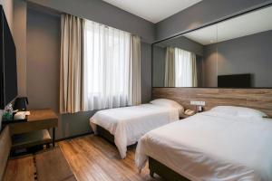 Katil atau katil-katil dalam bilik di 有集城市客栈锦绣中华店Unijoy Cityinn Splendid China Shenzhen