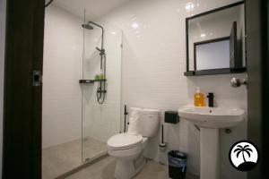 a bathroom with a shower and a toilet and a sink at Paradise Suite at KK Times Square, beside Imago in Kota Kinabalu