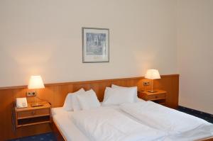 Voodi või voodid majutusasutuse Inselhotel Faakersee toas