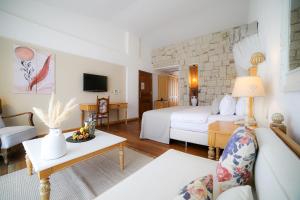 Кровать или кровати в номере Cocos The Club Solto