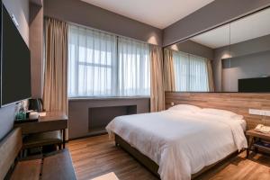Katil atau katil-katil dalam bilik di 有集城市客栈锦绣中华店Unijoy Cityinn Splendid China Shenzhen