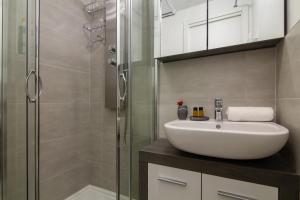 a bathroom with a sink and a shower at Appartement Paccard 305 - Happy Rentals in Chamonix