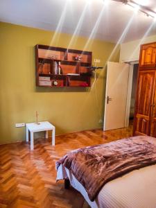 a room with a bed and a table in it at Center 1 Podgorica in Podgorica