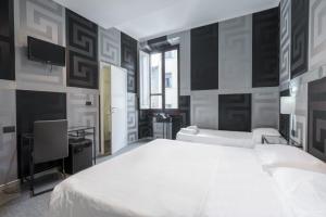 Postel nebo postele na pokoji v ubytování Hotel Argentina