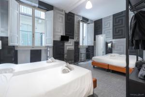 Postel nebo postele na pokoji v ubytování Hotel Argentina