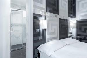 Postel nebo postele na pokoji v ubytování Hotel Argentina