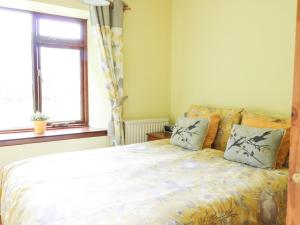 Ένα ή περισσότερα κρεβάτια σε δωμάτιο στο Flodden Edge Farm Cottage