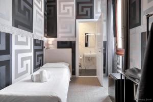Postel nebo postele na pokoji v ubytování Hotel Argentina
