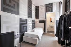 Postel nebo postele na pokoji v ubytování Hotel Argentina