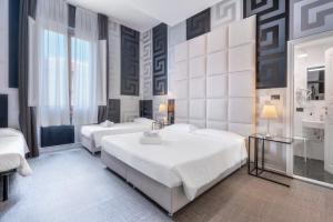 Postel nebo postele na pokoji v ubytování Hotel Argentina