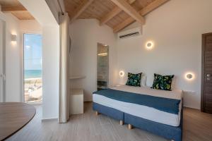Postel nebo postele na pokoji v ubytování GT Beach + 37 fotografií