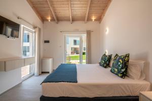 Postel nebo postele na pokoji v ubytování GT Beach