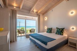 Postel nebo postele na pokoji v ubytování GT Beach