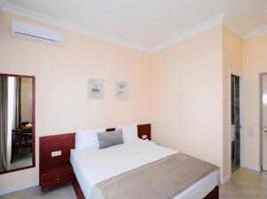 Voodi või voodid majutusasutuse Grand Fortune Hotel toas