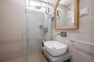 Ванная комната в Cayres Suites Surdo