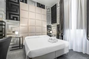 Postel nebo postele na pokoji v ubytování Hotel Argentina