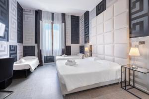 Postel nebo postele na pokoji v ubytování Hotel Argentina