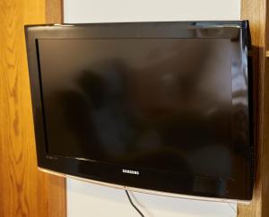 Televízia a/alebo spoločenská miestnosť v ubytovaní Appartement Slope & Smile